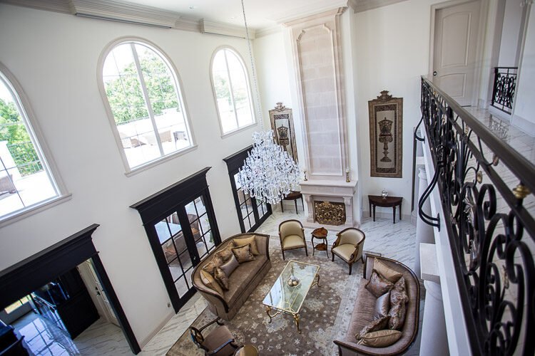 Grand two-story sitting room with arched windows