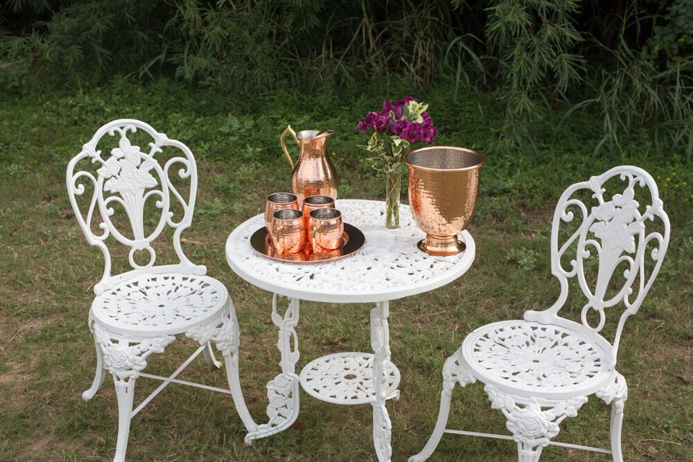 Garden table set with copper and flowers