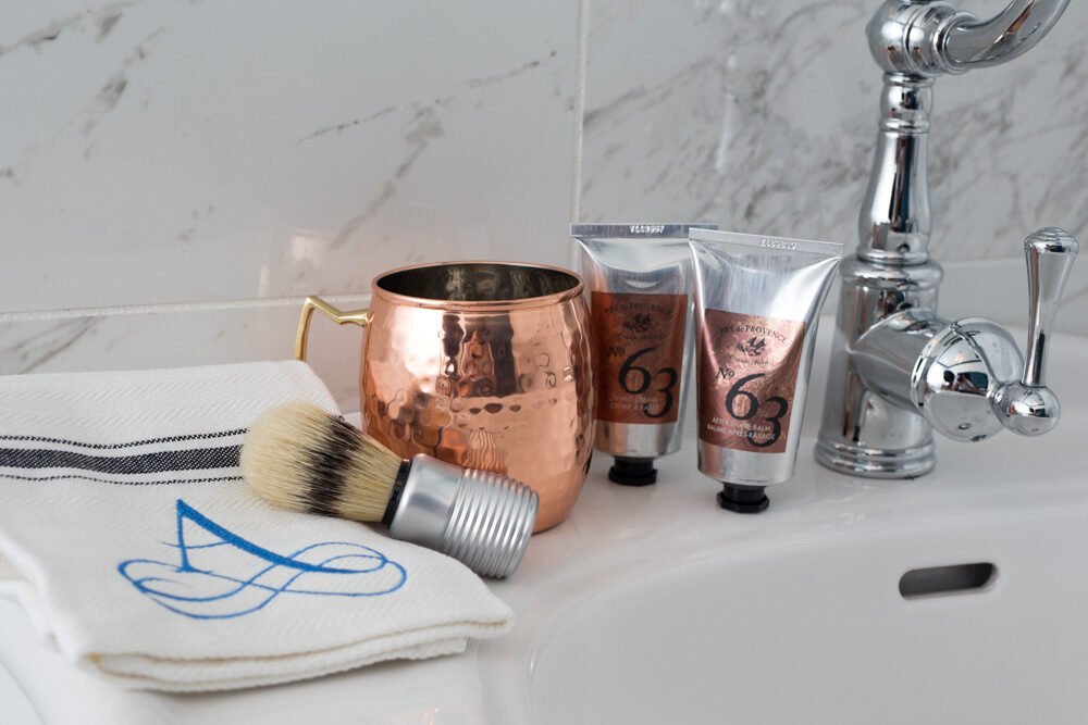 Copper and monogrammed linen on marble