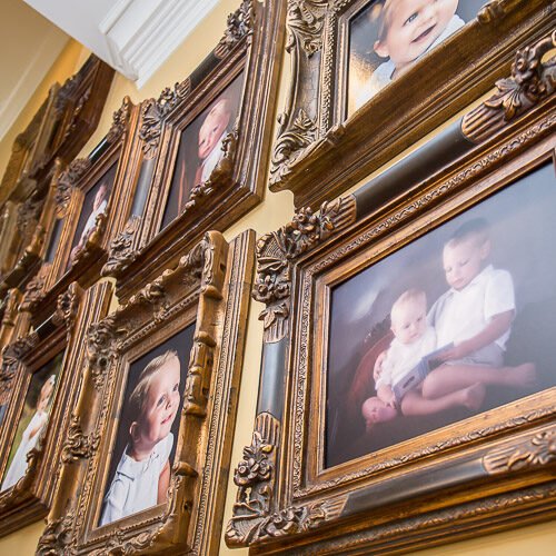 Framed gallery wall of family photographs